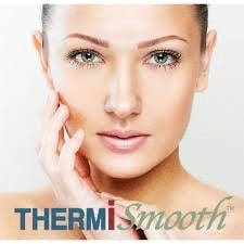 attractive woman with smooth skin looks forward, with the words ThermiSmooth in front of her.