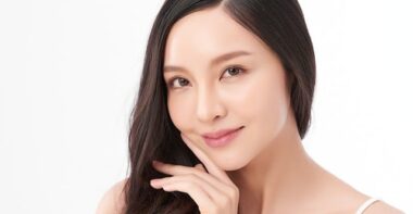 asian woman with clean fresh skin on white background