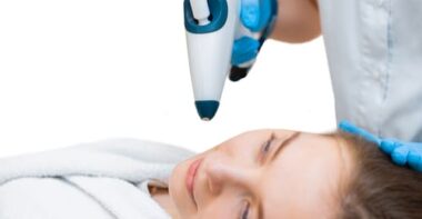 girl is doing an anti age cool lifting procedure with a non injection gun